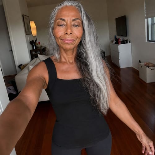 Ayah customer wearing the black Restore Bra Tank at home