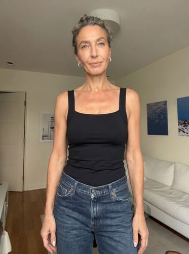 Ayah customer styling the black Restore Bra Tank with jeans